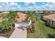 Charming single Gathering home with a two car garage, tile roof, paved driveway and mature landscaping at 13278 Huerta St, Venice, FL 34293