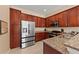 Well-equipped kitchen with granite countertops, stainless steel appliances, and ample cabinet space at 13278 Huerta St, Venice, FL 34293