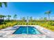 Community spa with black metal fence and landscaped greenery at 13278 Huerta St, Venice, FL 34293