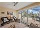 The sunroom has a ceiling fan and views of the screened-in patio at 13278 Huerta St, Venice, FL 34293