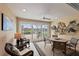 The sunroom features a ceiling fan and lovely views of the water at 13278 Huerta St, Venice, FL 34293