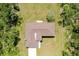 An aerial view of a well-maintained home with an intricate roof design at 13341 Drummond Ave, Port Charlotte, FL 33953