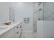 Elegant bathroom with modern fixtures, double vanity, and a glass-enclosed shower at 13341 Drummond Ave, Port Charlotte, FL 33953