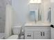A traditional bathroom featuring a vanity and shower-tub combo at 13341 Drummond Ave, Port Charlotte, FL 33953