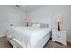 Comfortable bedroom showcasing a full bed, side tables, and natural light at 13341 Drummond Ave, Port Charlotte, FL 33953