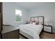 Comfortable bedroom featuring natural light, a plush bed, and neutral decor at 13341 Drummond Ave, Port Charlotte, FL 33953