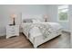 Bright bedroom featuring a full bed and a lovely faux fur throw blanket at 13341 Drummond Ave, Port Charlotte, FL 33953