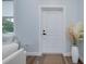 A white entryway, with a door, modern decor, and neutral tones creating a peaceful ambiance at 13341 Drummond Ave, Port Charlotte, FL 33953
