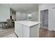 A view of the kitchen island that connects to the living spaces and hallways at 13341 Drummond Ave, Port Charlotte, FL 33953