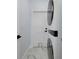 Efficient laundry room with stacked washer and dryer for convenience at 13341 Drummond Ave, Port Charlotte, FL 33953