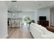 Bright, open-concept living room with a kitchen, dining area, and modern furnishings at 13341 Drummond Ave, Port Charlotte, FL 33953