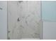 Marble-look shower with glass enclosure and modern rain-style shower head at 13341 Drummond Ave, Port Charlotte, FL 33953