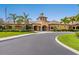 Exterior view of the community clubhouse with manicured landscaping and a circular driveway at 1342 Maseno Dr, Venice, FL 34292