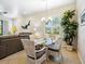 Bright dining room with natural lighting, comfortable seating, and view to the living room at 1342 Maseno Dr, Venice, FL 34292