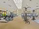 Well-equipped gym with treadmills, weight machines, and ample natural light at 1342 Maseno Dr, Venice, FL 34292