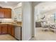 Modern kitchen with stainless steel appliances and granite countertops leading into the dining area at 1342 Maseno Dr, Venice, FL 34292