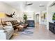 Spacious living area with tile floors, modern lighting, and a seamless flow to other rooms at 1342 Maseno Dr, Venice, FL 34292