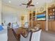 Community living room featuring a TV, bookshelves, and comfortable seating area at 1342 Maseno Dr, Venice, FL 34292