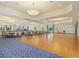 Spacious meeting room with ample seating, lighting, hardwood dance floor, and neutral tones, perfect for gatherings and events at 1342 Maseno Dr, Venice, FL 34292