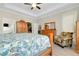 Bedroom featuring wood furnishings, closet, ensuite bathroom and seating area at 13730 Vancanza, Venice, FL 34293