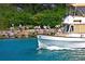 Elegant yacht sailing through clear blue waters, offering a luxurious and scenic experience at 13730 Vancanza, Venice, FL 34293
