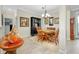 Cozy dining room with a wooden table set for four and a classic wooden hutch at 13730 Vancanza, Venice, FL 34293