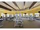 Large gym with a variety of weight and cardio machines, ceiling fans, and flat-screen TVs at 13730 Vancanza, Venice, FL 34293