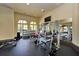 Well-equipped gym with weight machines, free weights, and a mirror for form checks at 13730 Vancanza, Venice, FL 34293