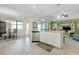Open concept kitchen with a center island and dining area, great for entertaining at 13730 Vancanza, Venice, FL 34293