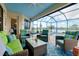 Comfortable outdoor seating area with pool and lake views at 13730 Vancanza, Venice, FL 34293