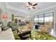 Living area features an open floor plan, tile floors, and a palm rug at 13730 Vancanza, Venice, FL 34293