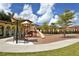 Community playground with slides, swings, and play structures for children to enjoy at 13730 Vancanza, Venice, FL 34293