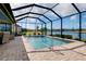 Relaxing pool area with a screened enclosure and stunning waterfront views at 13730 Vancanza, Venice, FL 34293