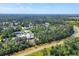 An aerial view of a residential neighborhood, with views of a body of water at 1449 Overhead St, North Port, FL 34288
