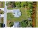 Aerial view of the property showing the home, driveway, and surrounding landscape at 1449 Overhead St, North Port, FL 34288