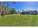 A large backyard provides plenty of room to roam, and potential for entertaining at 1449 Overhead St, North Port, FL 34288