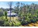 Scenic backyard view of a well-maintained lawn and the neighboring forest at 1449 Overhead St, North Port, FL 34288