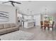 Open layout showcasing the living room, dining area, and kitchen with stainless steel appliances at 1449 Overhead St, North Port, FL 34288