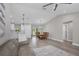 Open layout showcasing the living room, dining area, and kitchen with stainless steel appliances at 1449 Overhead St, North Port, FL 34288