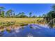 A peaceful pond is located at the rear of the property at 1449 Overhead St, North Port, FL 34288