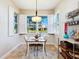 Charming breakfast nook with white plantation shutters and a lovely view of the neighborhood at 1545 Maseno Dr, Venice, FL 34292