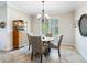 Inviting dining room with plantation shutters and modern chandelier at 1545 Maseno Dr, Venice, FL 34292