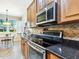 Kitchen featuring stainless steel appliances and granite countertops at 1545 Maseno Dr, Venice, FL 34292