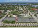 A captivating aerial view shows well-maintained tennis and basketball courts near a beautiful waterfront community at 1572 Jasper Ct, Venice, FL 34292