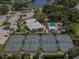 Aerial shot of the community with tennis courts, pool, and the main building at 1572 Jasper Ct, Venice, FL 34292