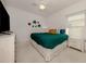 Cozy bedroom with bright natural light, ceiling fan, and turtle decor at 1572 Jasper Ct, Venice, FL 34292