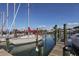 View of the docks at the marina, with sailboats, clear skies, and lovely water views at 1572 Jasper Ct, Venice, FL 34292