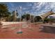Interactive splash fountain with palm trees under a sunny sky, perfect for Gathering fun at 1572 Jasper Ct, Venice, FL 34292