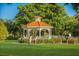 Picturesque gazebo nestled among lush greenery, offering a serene outdoor retreat at 1572 Jasper Ct, Venice, FL 34292