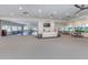 Expansive community lounge featuring a TV, flexible seating, and access to outdoor views at 1572 Jasper Ct, Venice, FL 34292
